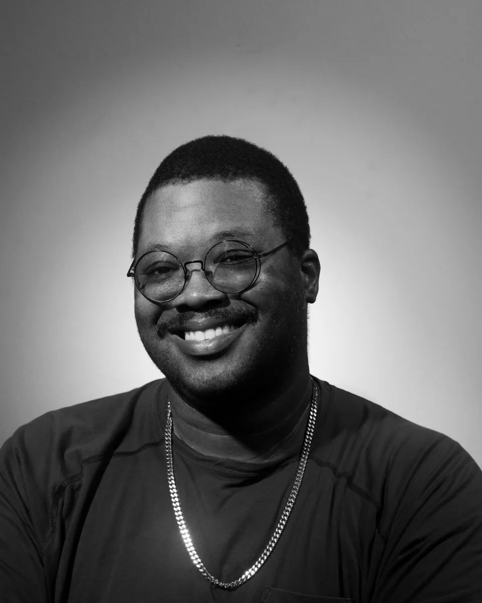Denzel Walkes, a black and white studio portrait